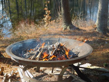 High angle view of bonfire  in firepit overlooking lake