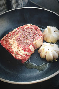 High angle view of meat in cooking pan