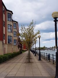 Street amidst buildings against sky