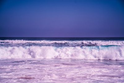 Scenic view of sea against clear blue sky