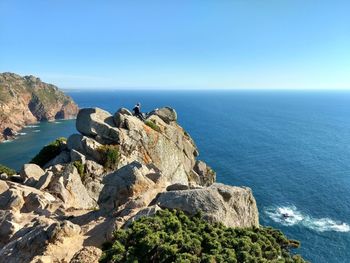 Scenic view of sea against clear blue sky