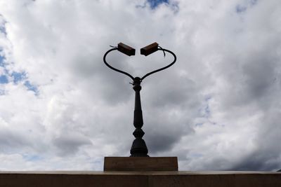 Low angle view of street light against sky