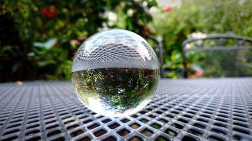 Close-up of crystal ball on street