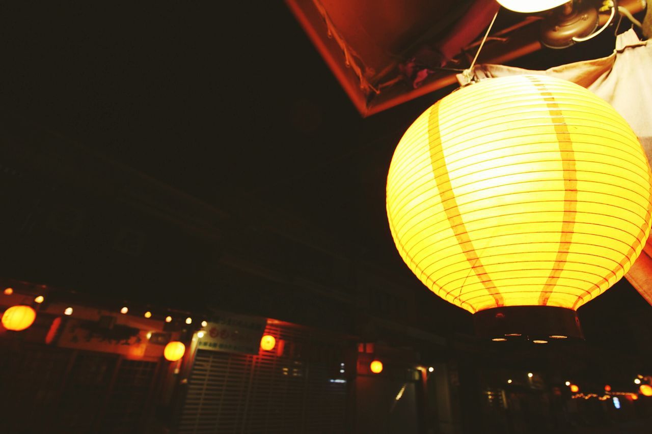 illuminated, low angle view, lighting equipment, night, hanging, lantern, decoration, ceiling, architecture, electric light, built structure, electricity, electric lamp, indoors, light - natural phenomenon, chinese lantern, no people, glowing, sky, street light