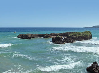 Scenic view of sea against clear sky