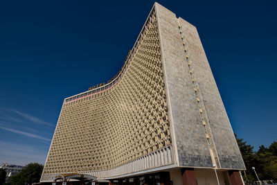 Low angle view of building against blue sky