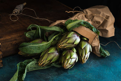 Close-up of vegetables on table against black background