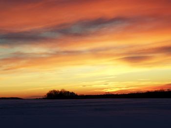 Scenic view of landscape against sky during sunset