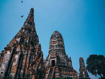 Low angle view of traditional building against blue sky