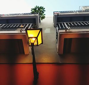 Low angle view of illuminated building against sky