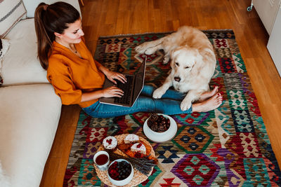 Woman with dog at home