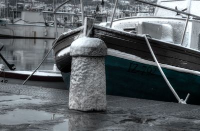 Boats moored at harbor