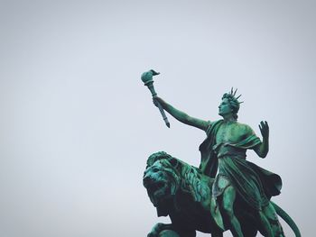 Low angle view of statue against sky