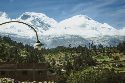 Scenic view of snowcapped huascaran mountain against sky