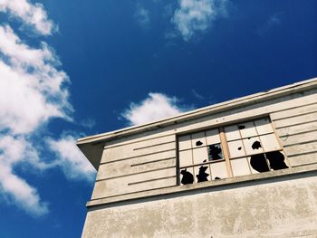 Low angle view of building against blue sky