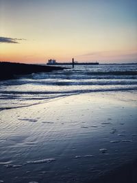 Scenic view of sea against sky at sunset