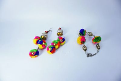 High angle view of multi colored pencils on white background