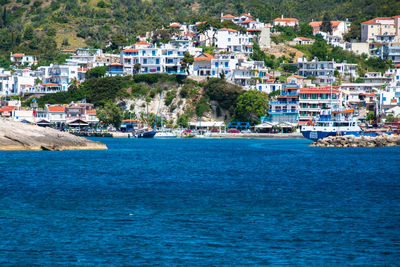 Scenic view of sea by town