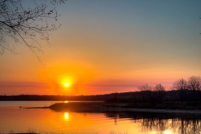 Scenic view of lake at sunset