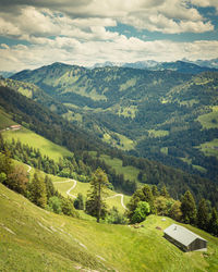 Scenic view of landscape and mountains against sky