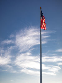 Low angle view of flag against sky