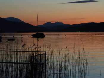 Scenic view of lake against sky during sunset