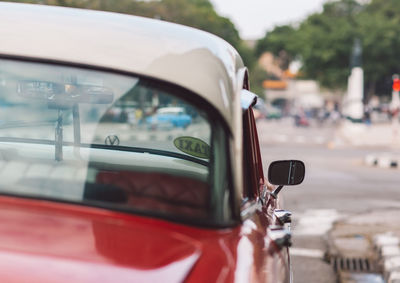 Reflection of car on side-view mirror