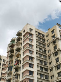 Low angle view of apartment building against sky