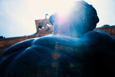 Close-up of statue against blue sky