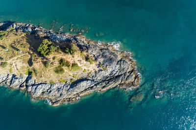 High angle view of rocks on sea