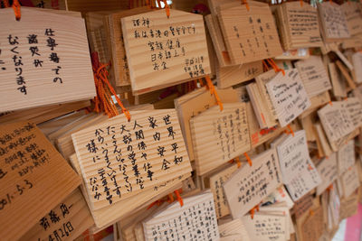 Full frame shot of text on small wooden placards