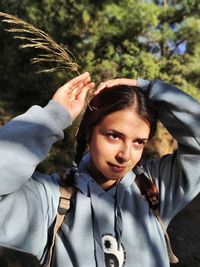 Portrait of young woman in forest