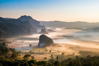Scenic view of mountains against sky during sunset