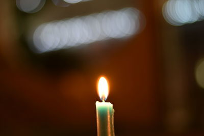 Close-up of illuminated candle