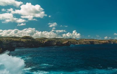 Scenic view of sea against blue sky