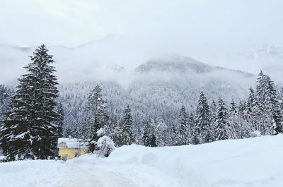 Scenic view of snow covered mountains against sky