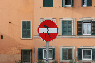 Road sign against building