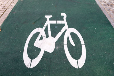 High angle view of bicycle lane sign