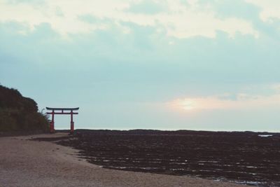 Scenic view of landscape against cloudy sky