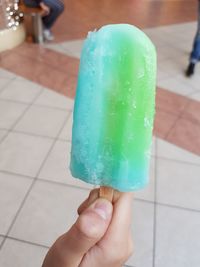 Cropped image of hand holding ice cream