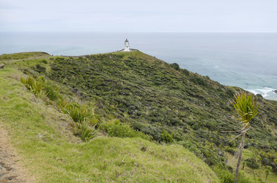 Coastal scenery with lighthouse around cape reinga at the north island in new zealand