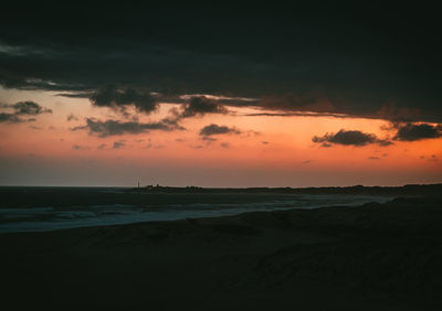 Scenic view of sea against sky at sunset