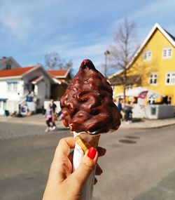 Hand holding ice cream cone