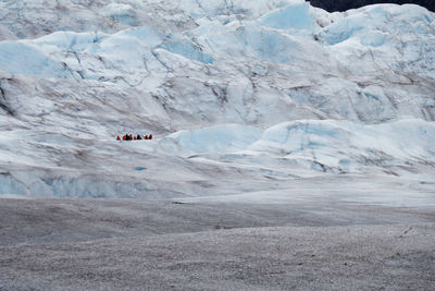 People treking on mendenhall glacier at juneau