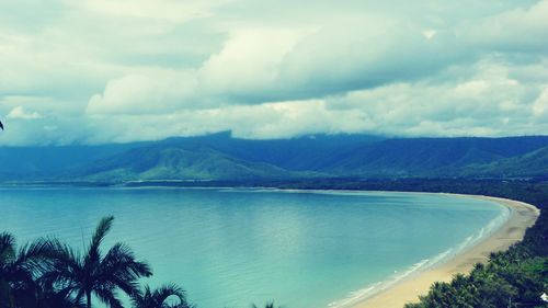 Scenic view of lake and mountains against sky