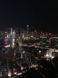 High angle view of illuminated buildings in city at night