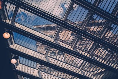 Low angle view of building seen through skylight