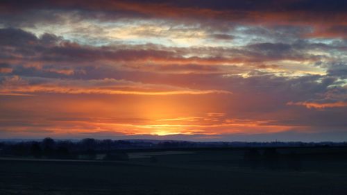 Scenic view of silhouette landscape against sky during sunset