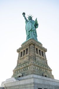 Low angle view of statue against sky