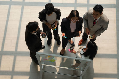 View from above of multiethnic business team working together in office